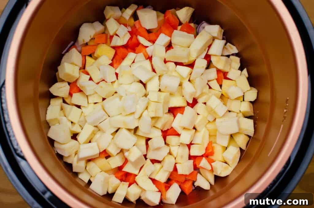 One-Pot Quinoa Vegetable Stew 7 Chopped Parsnip, Carrot, Swede and red onion frying in olive oil in a pressure cooker pot