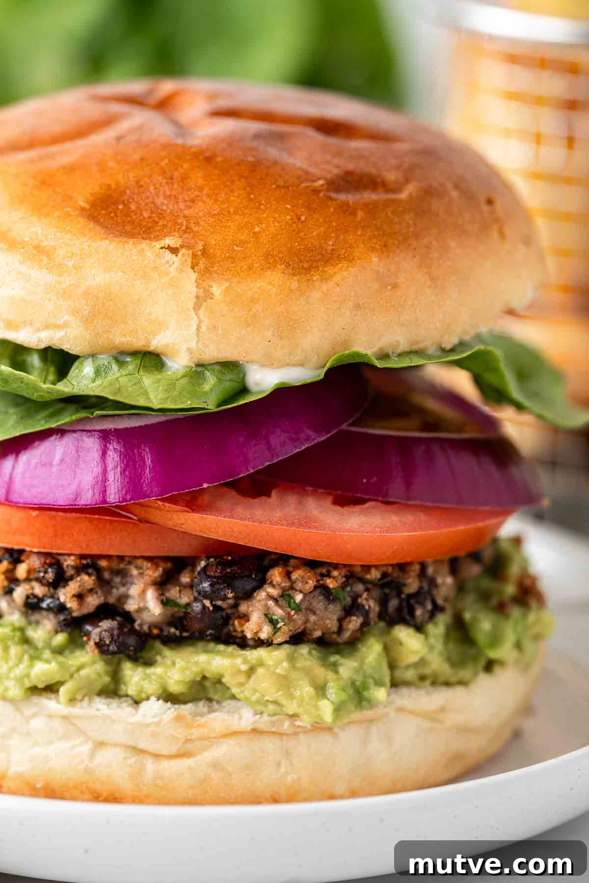 Close up of vegan black bean burger showing the layers.