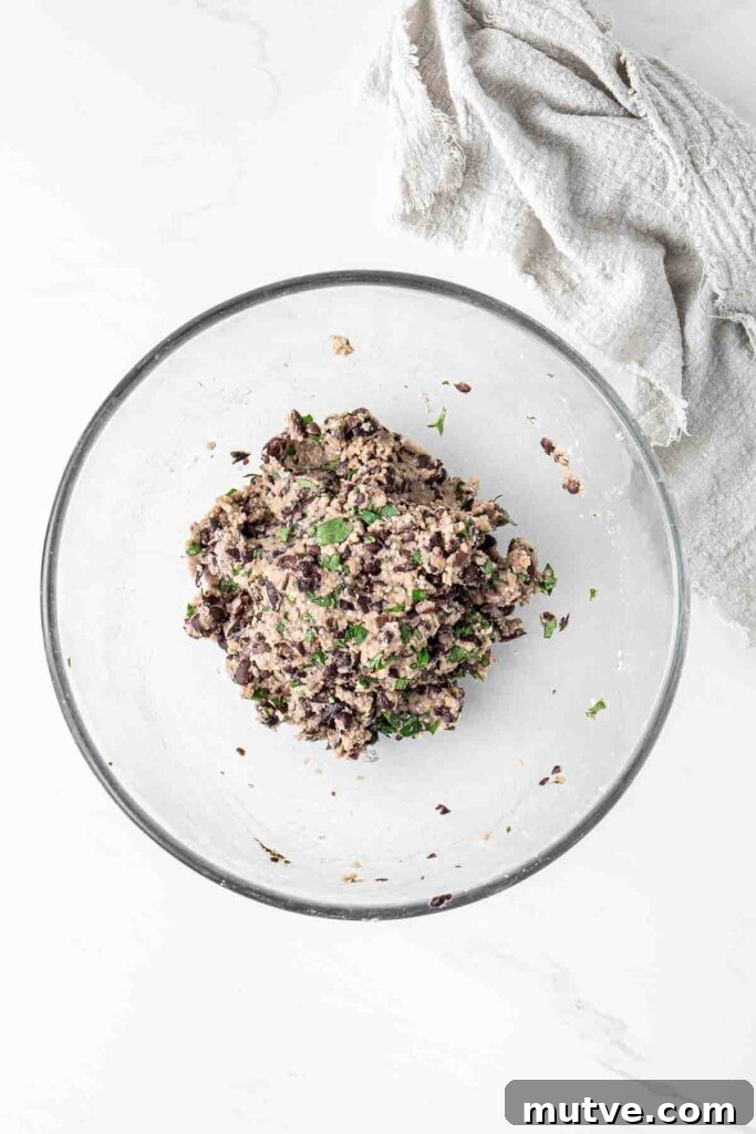 Burger mixture in a glass bowl.