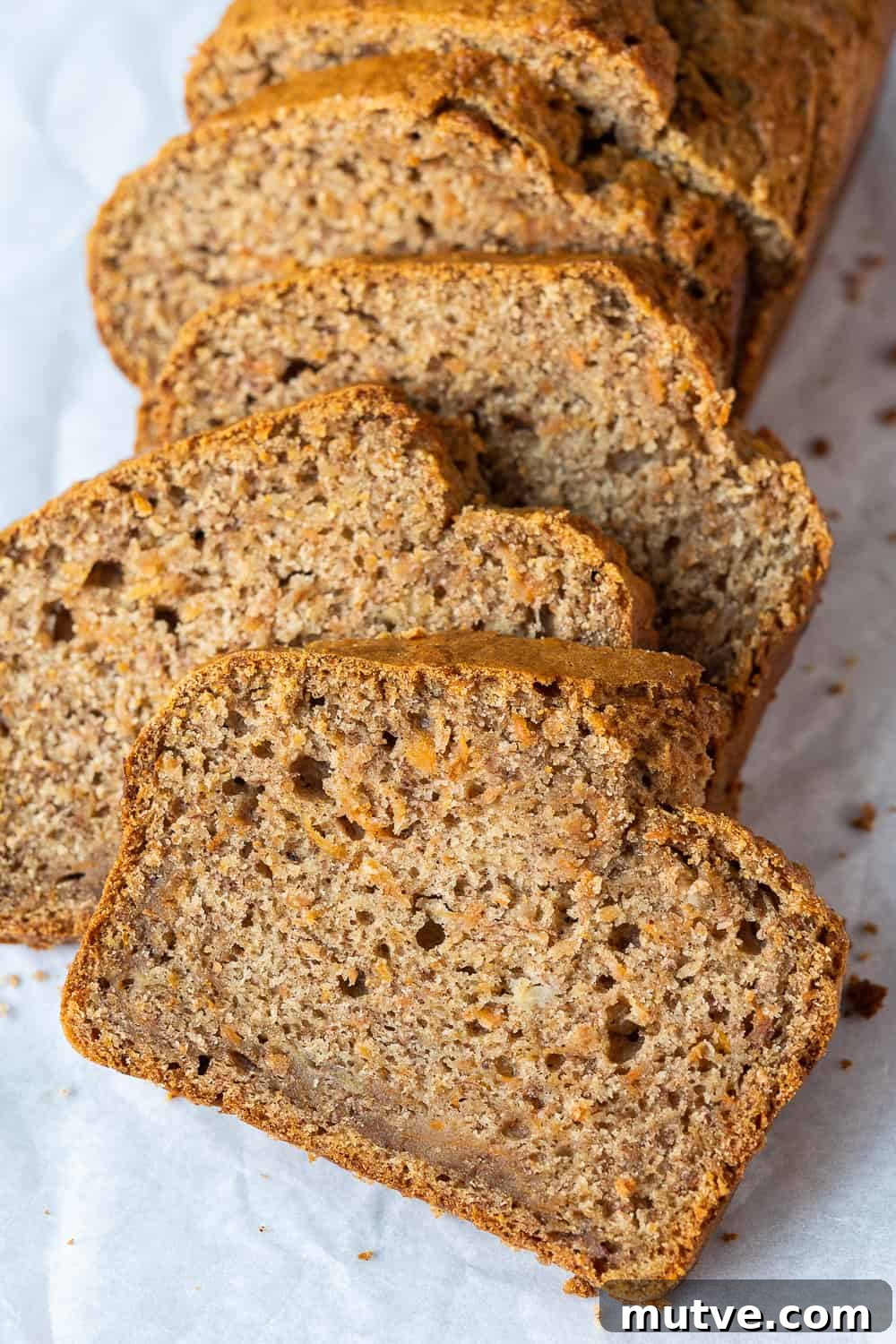 close up of a slice of vegan carrot banana bread