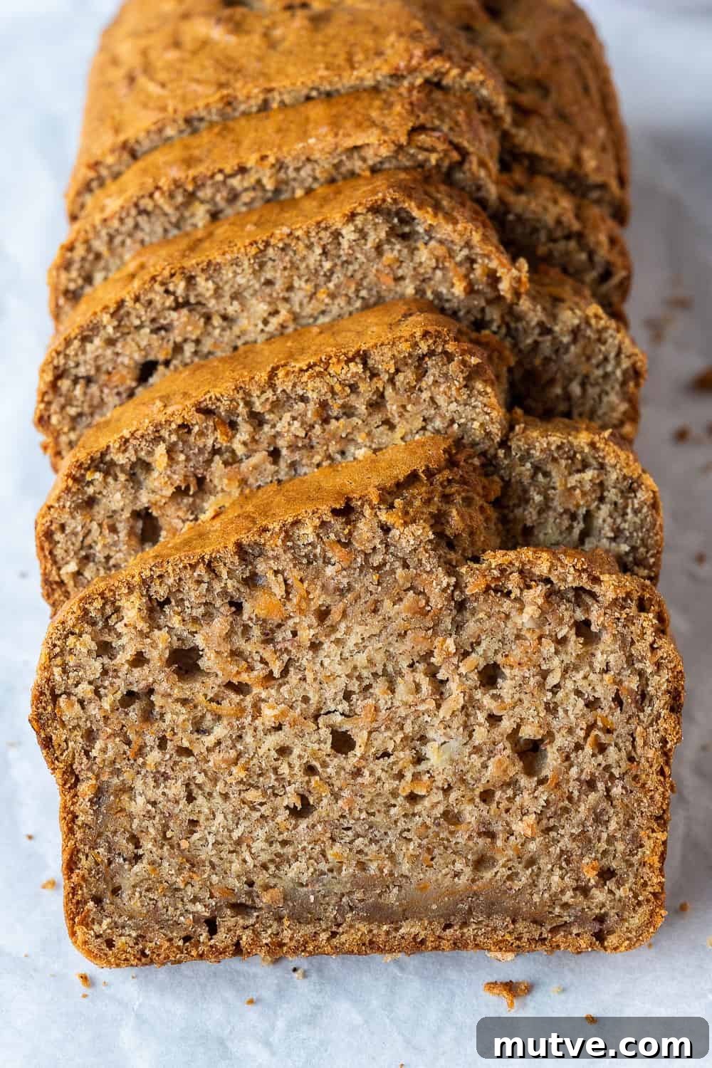 a row of slices of carrot banana bread