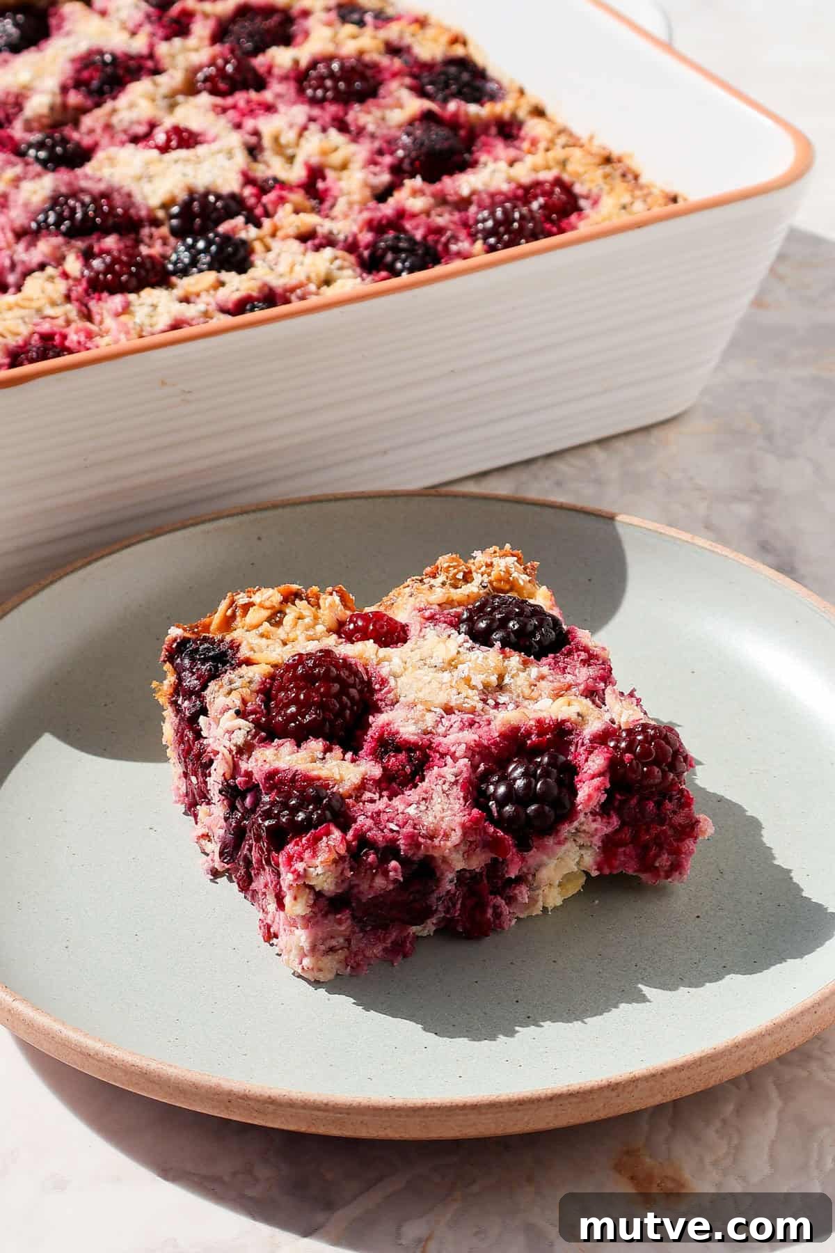 Blackberry Baked Oatmeal Recipe for Breakfast 9 Side of the the baked oatmeal on a plate.