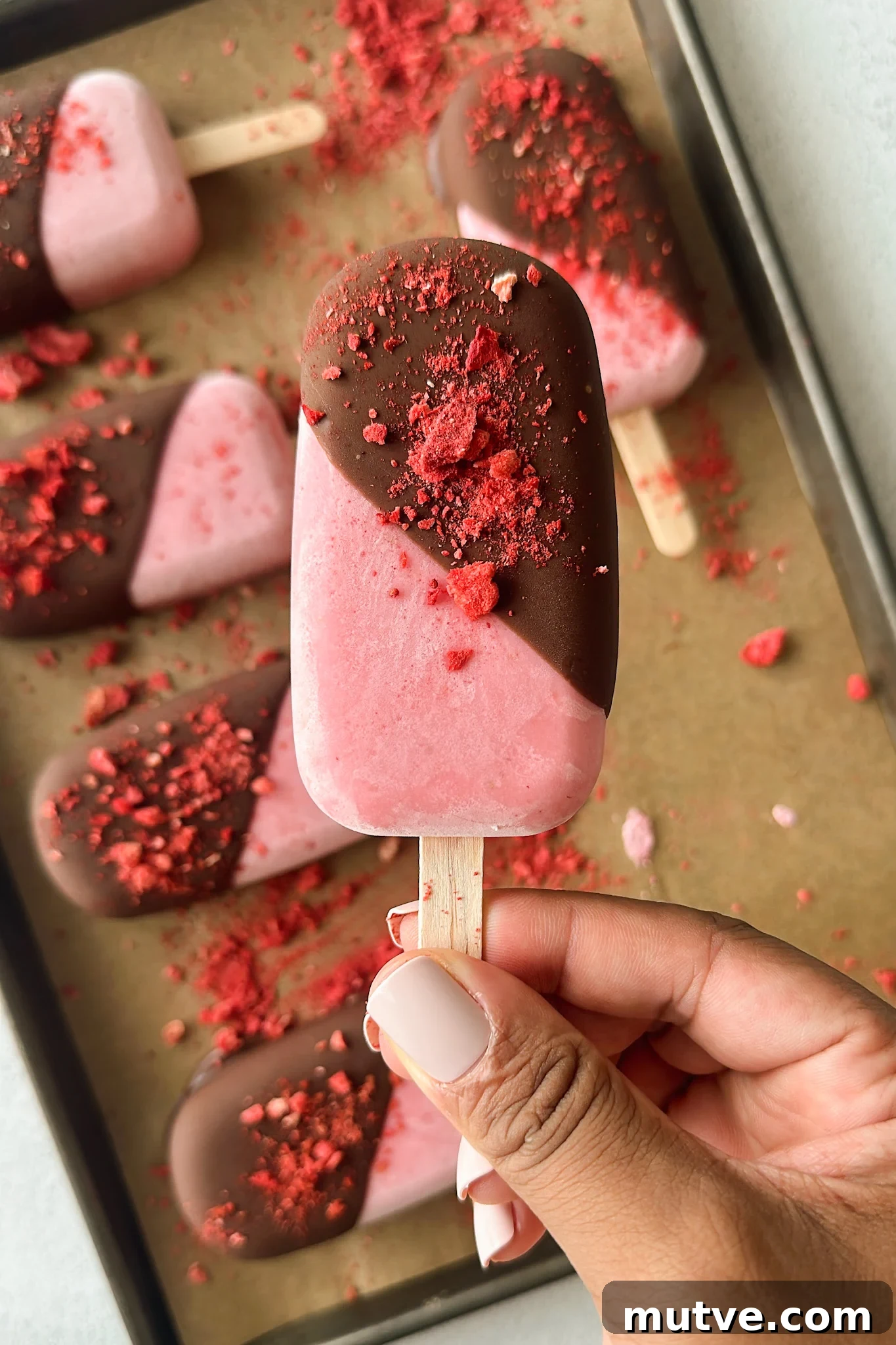Homemade Frozen Strawberry Yogurt Bars Recipe 6 Frozen strawberry yogurt bars half dipped in chocolate.