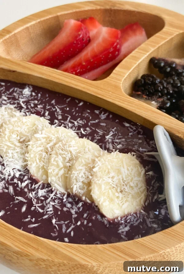 Homemade Frozen Strawberry Yogurt Bars Recipe 9 Acai bowl for kids served with sliced bananas, strawberries, blackberries and coconut.