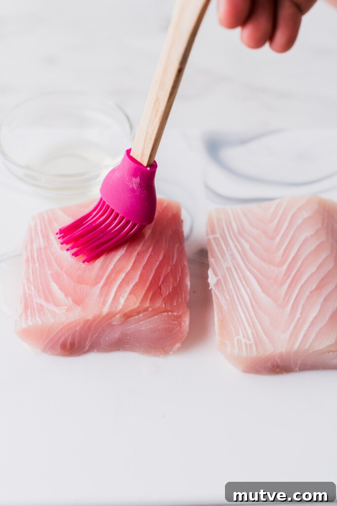 Crispy Air Fryer Mahi Mahi Recipe 5 brushing olive oil on mahi mahi fish.