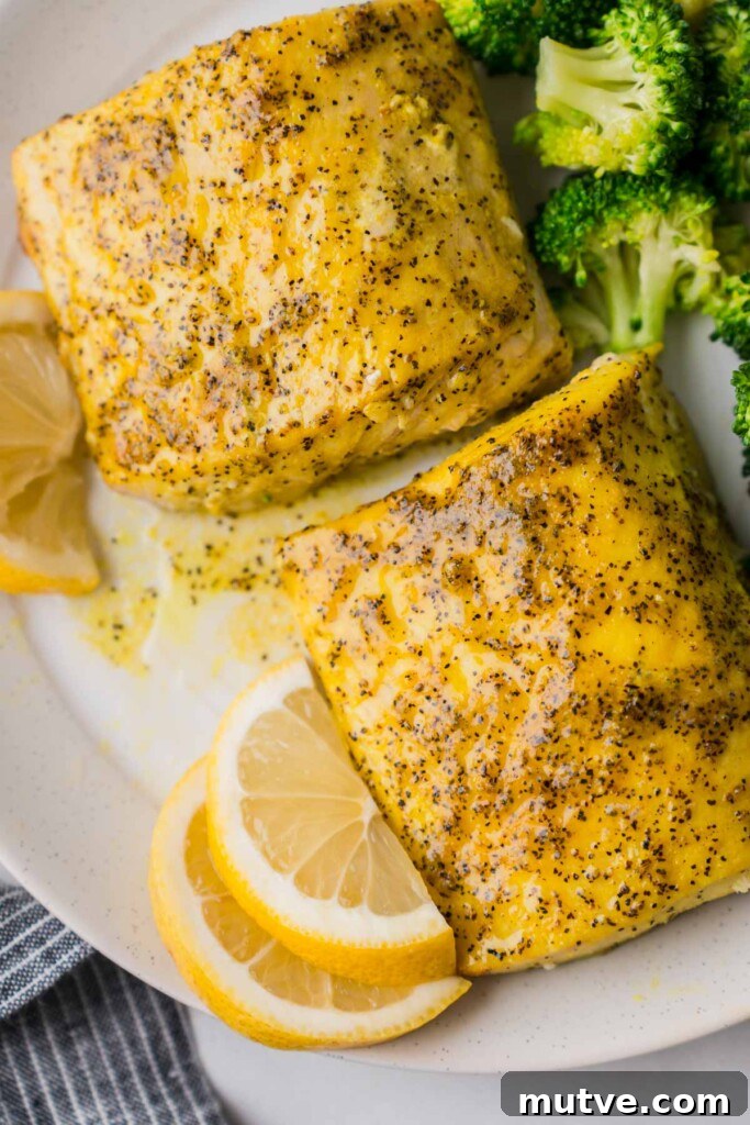 Crispy Air Fryer Mahi Mahi Recipe 9 cooked mahi mahi on a plate with broccoli.