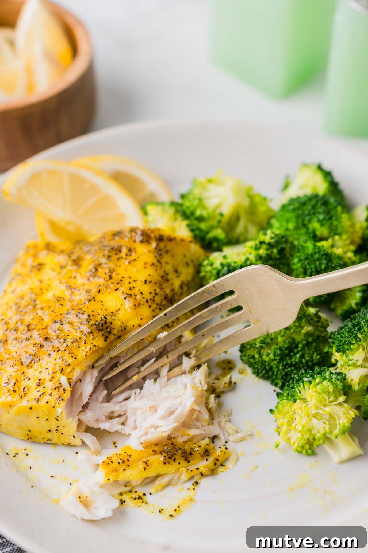Crispy Air Fryer Mahi Mahi Recipe 10 mahi mahi on a plate with a fork.