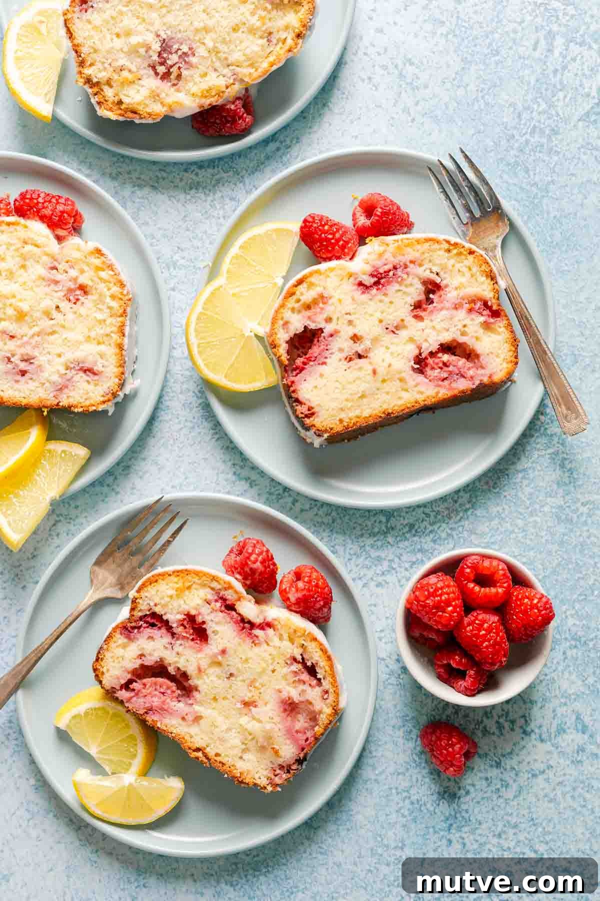 slices of raspberry lemon loaf on plates.