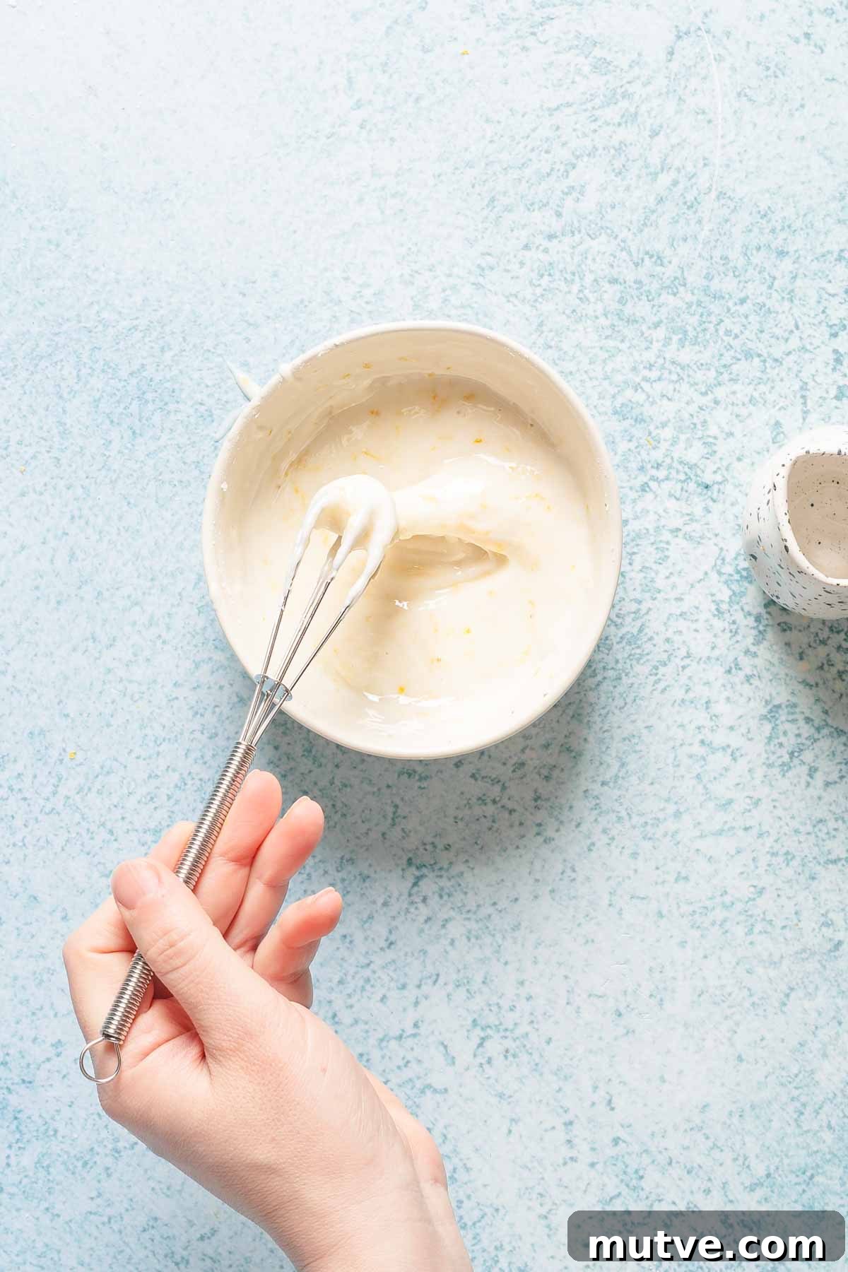 glaze being whisked in small bowl.