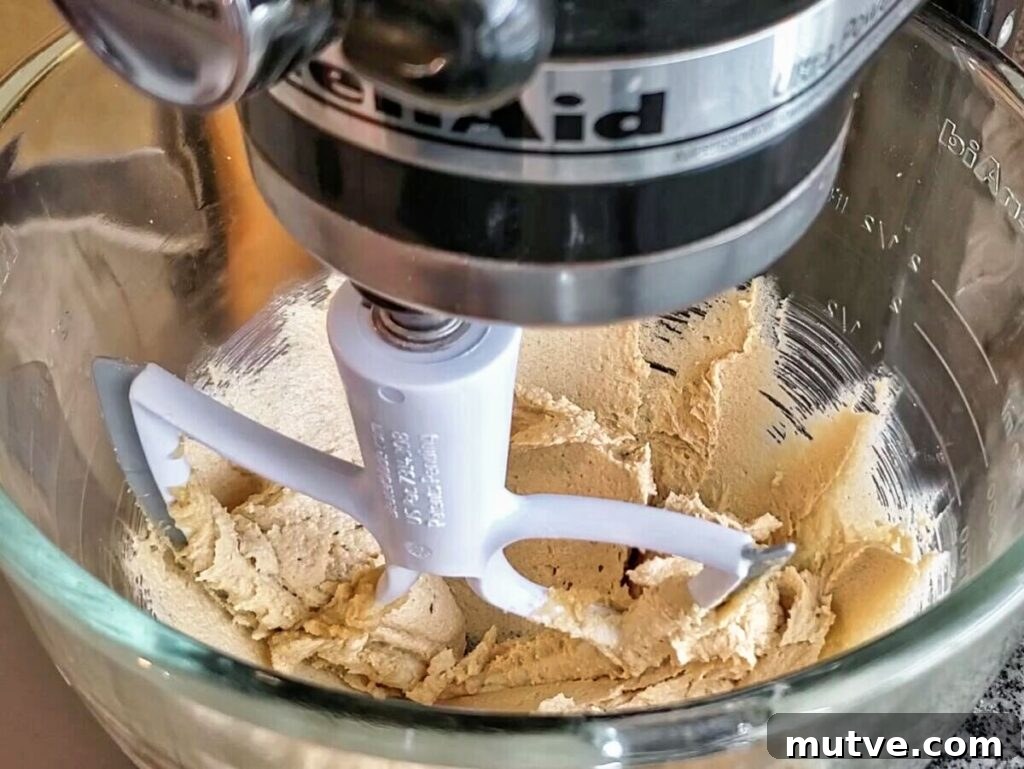 Gluten-Free Smores Cookies with Gooey Marshmallow and Chocolate 4 mixing wet ingredients together in glass stand mixer bowl.