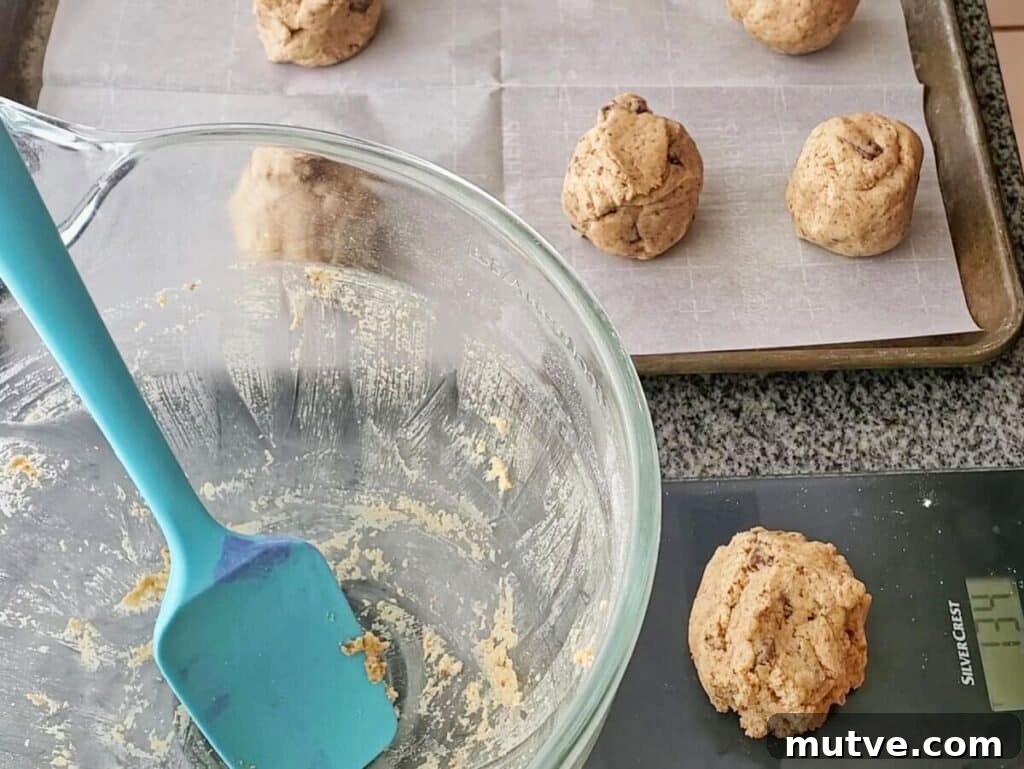 Gluten-Free Smores Cookies with Gooey Marshmallow and Chocolate 8 weighing large balls of cookie dough.