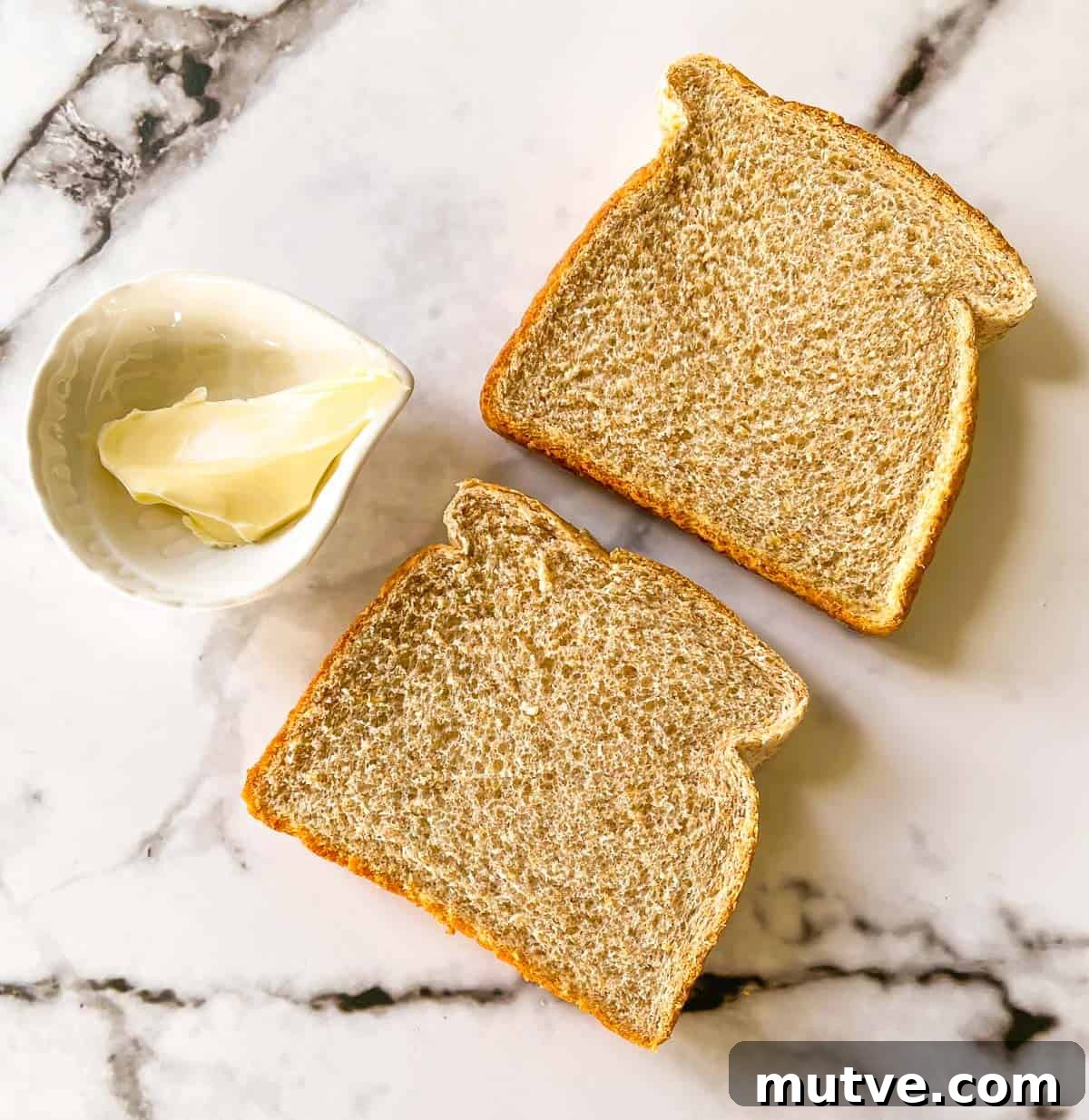 Ingredients for air fryer toast on a white countertop.