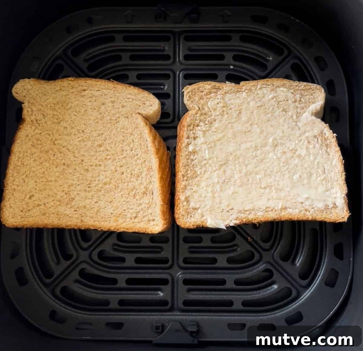 Bread in the air fryer basket.