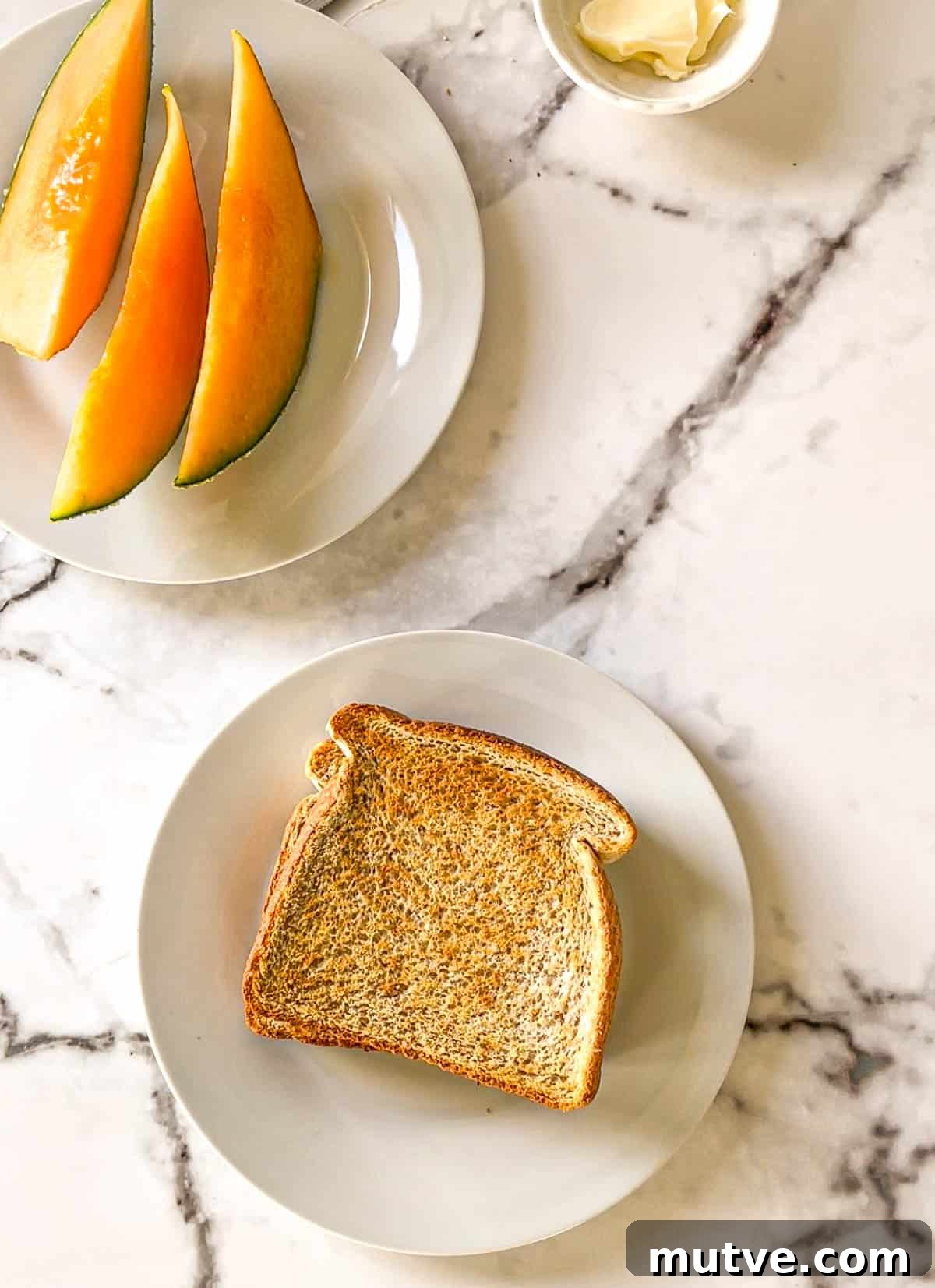 A closeup of air fryer toast with cantaloupe slices.