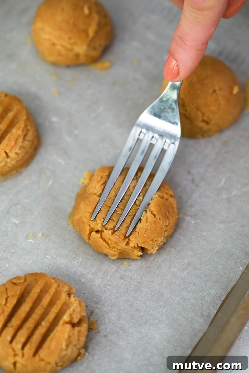 pressing the cookie dough with a fork
