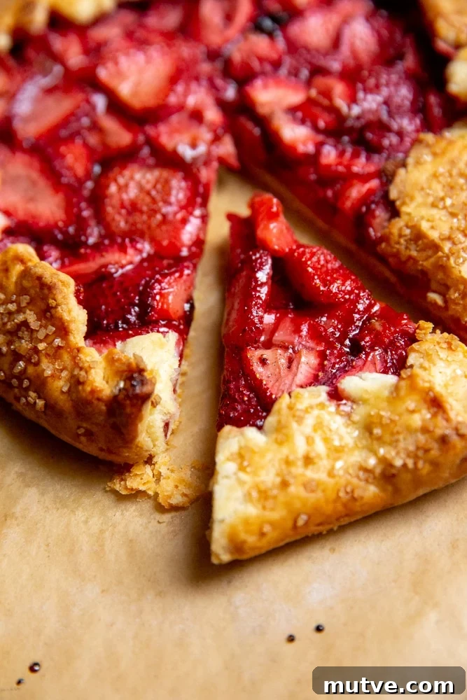 Close up of a slice of strawberry galette with gluten free crust.