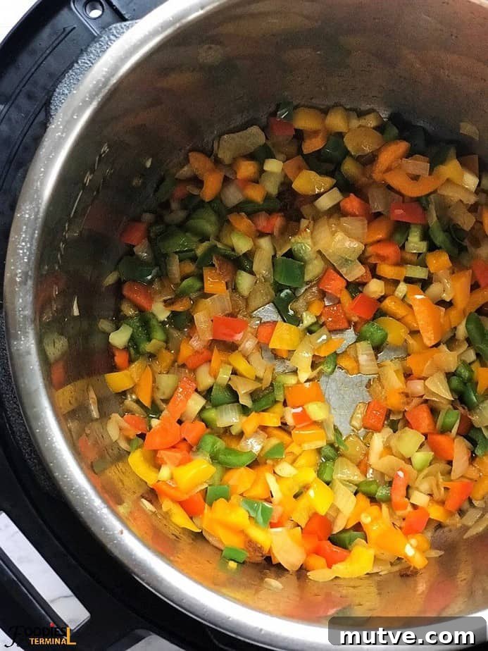colorful bell peppers being sauteed in Instant pot