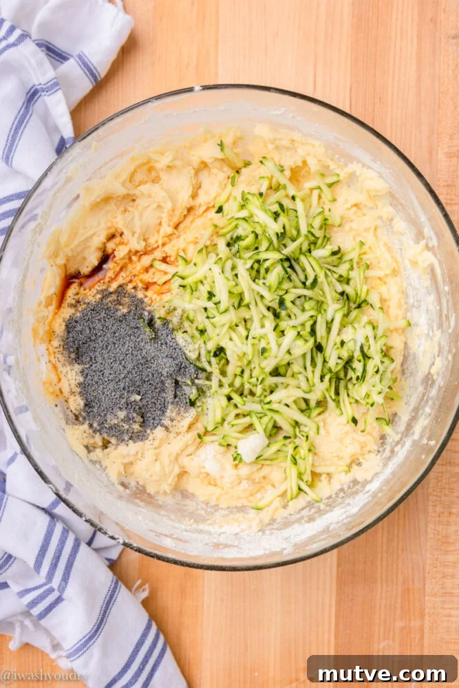 zucchini and poppy seeds in bowl with batter