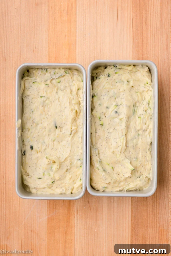 zucchini bread uncooked in pans.