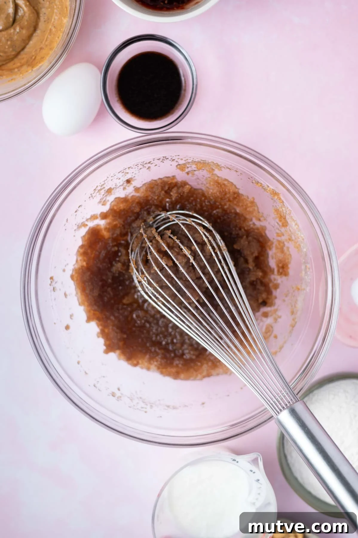 oil, sugars and salt whisked together in a glass bowl