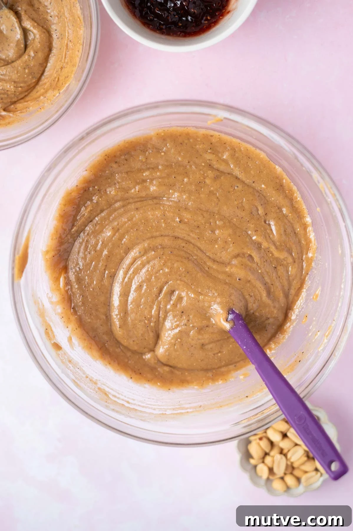 cake batter in a bowl with a spatula