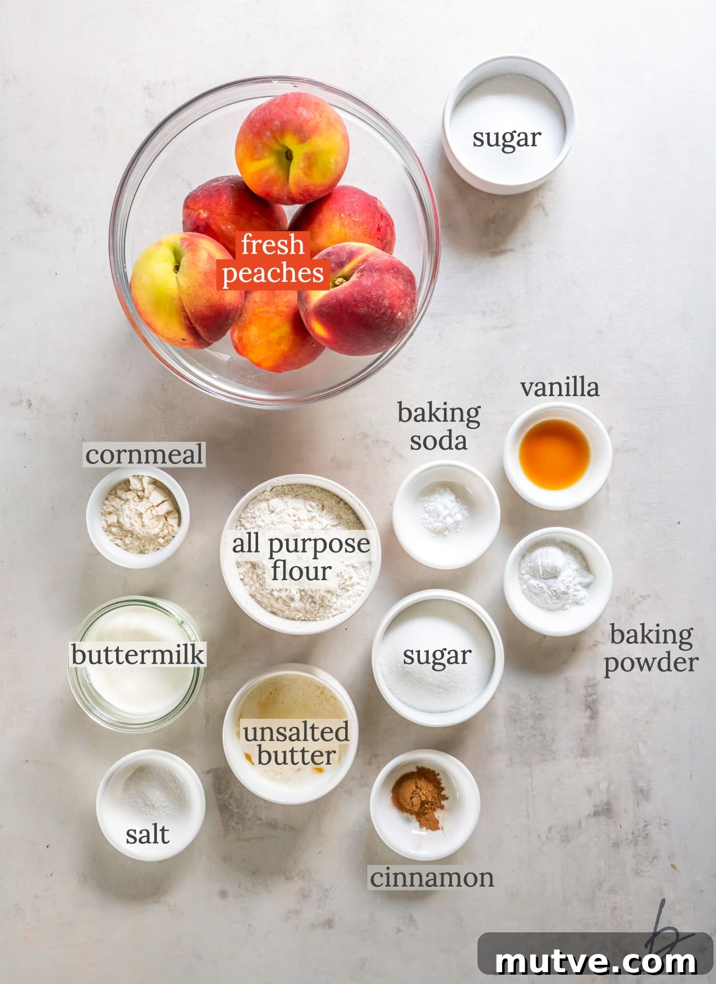 peach cobbler ingredients in bowls labeled with text