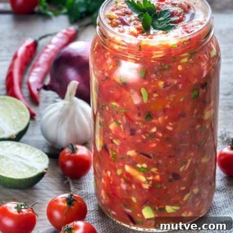 Jar of salsa with ingredients