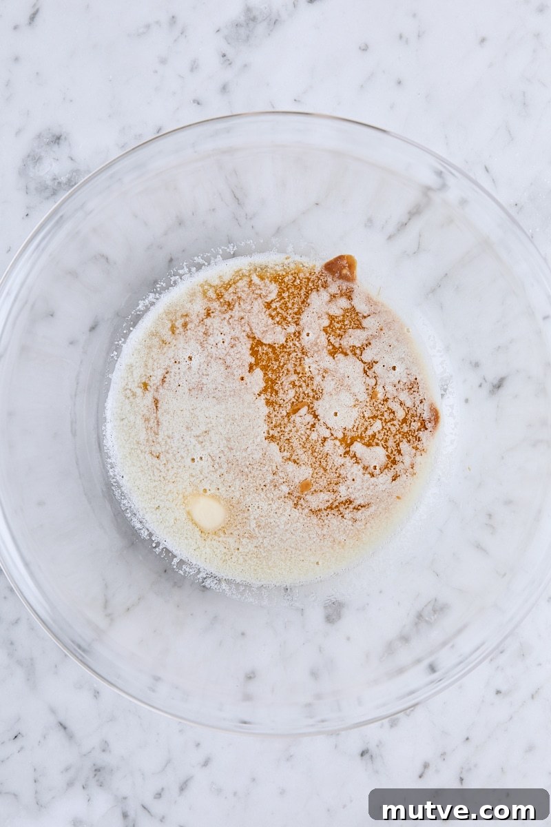 Melted butter and peanut butter in glass bowl