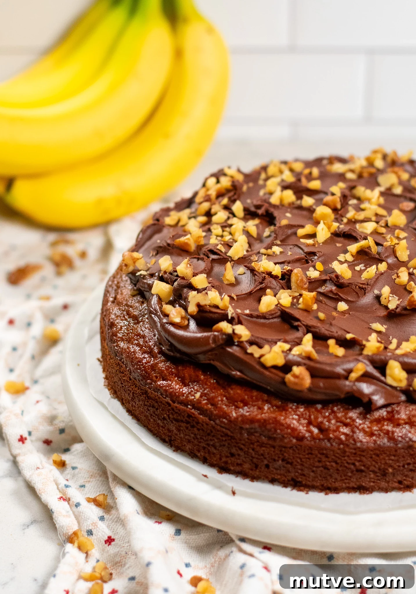 A banana walnut cake with chocolate ganache.