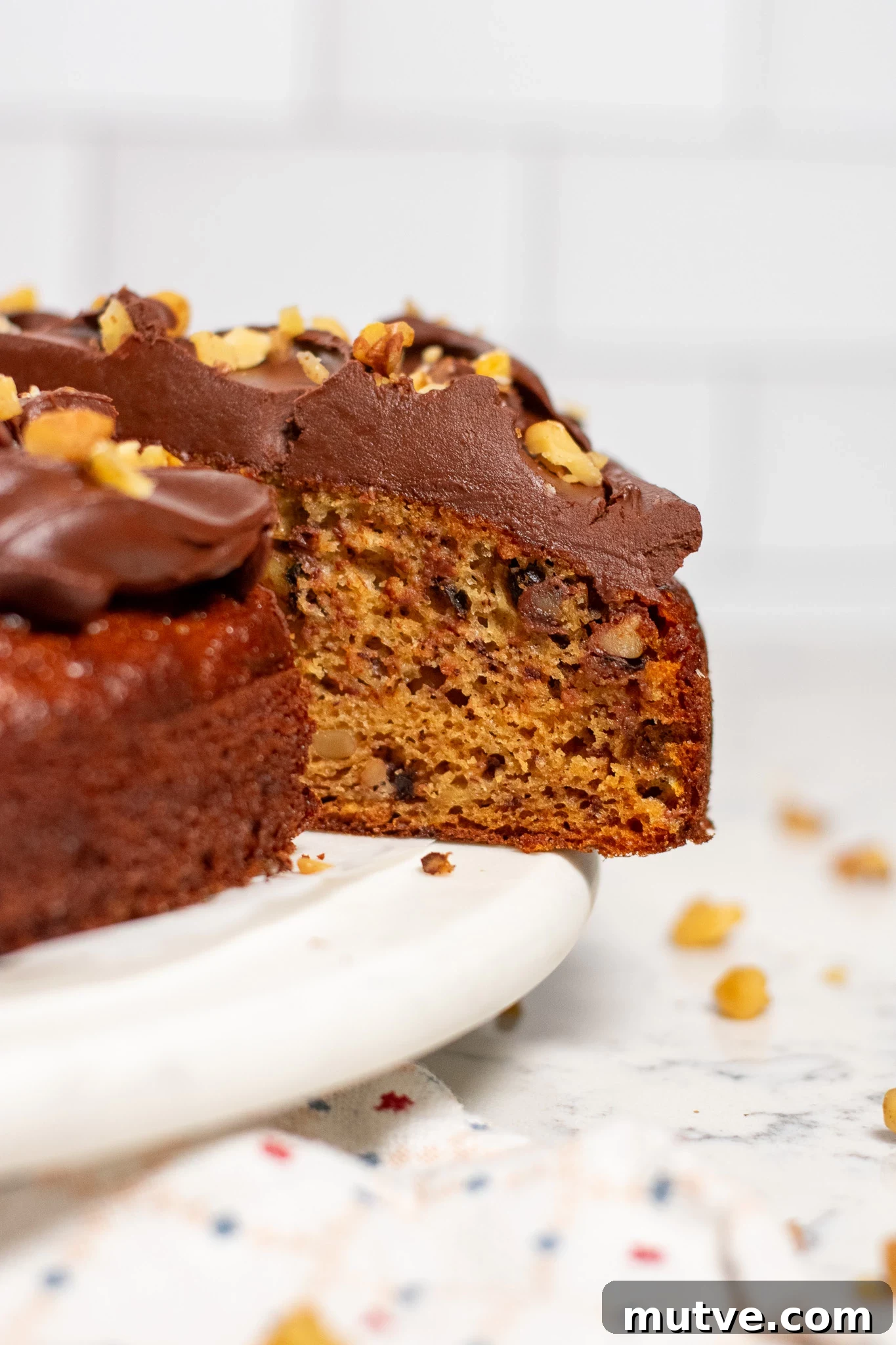 A banana walnut cake with chocolate ganache.