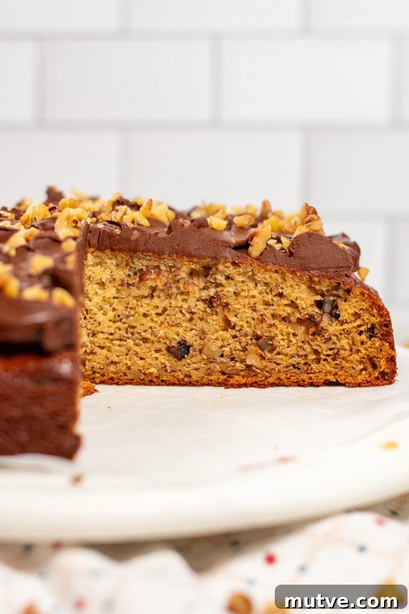 A banana walnut cake with chocolate ganache.