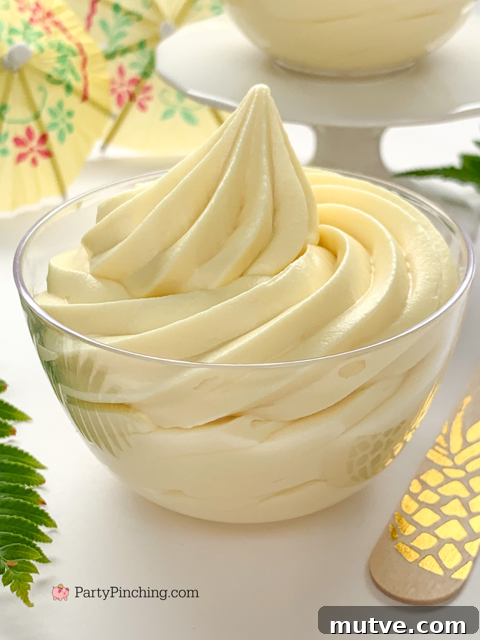 copycat Disney Dole whip recipe, pineapple ice cream homemade, homemade best easy dole whip recipe, 3 ingredients dole whip,  dole whip at home, quick and easy dole whip pineapple creamy ice cream with Mickey Mouse ears maraschino cherries drink umbrellas
