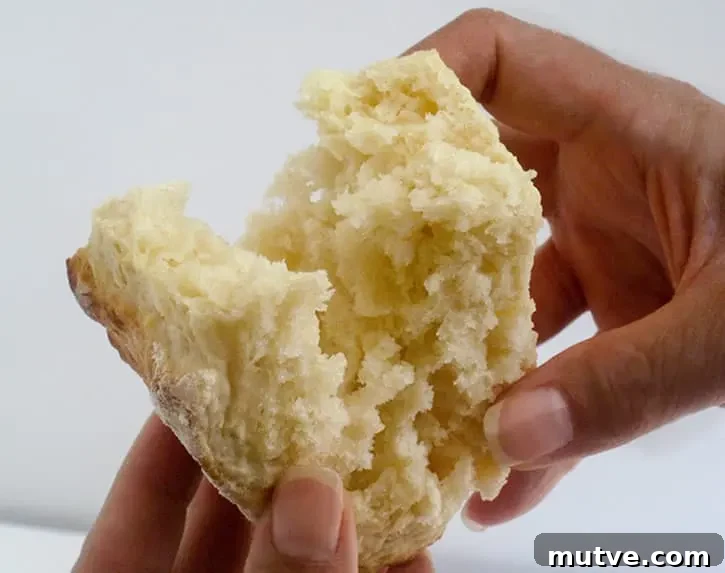 Breaking open a Fluffy Buttermilk Biscuit to show texture