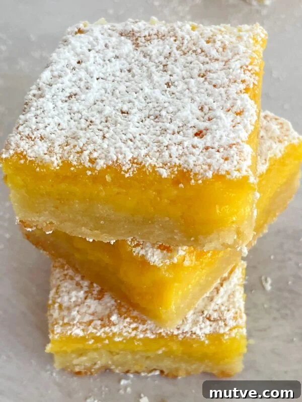 Tangy Passion Fruit Bars Recipe with Shortbread Crust 7 stack of passion fruit bars.
