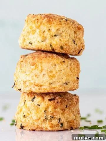 Close up of three scones stacked with a light colored background