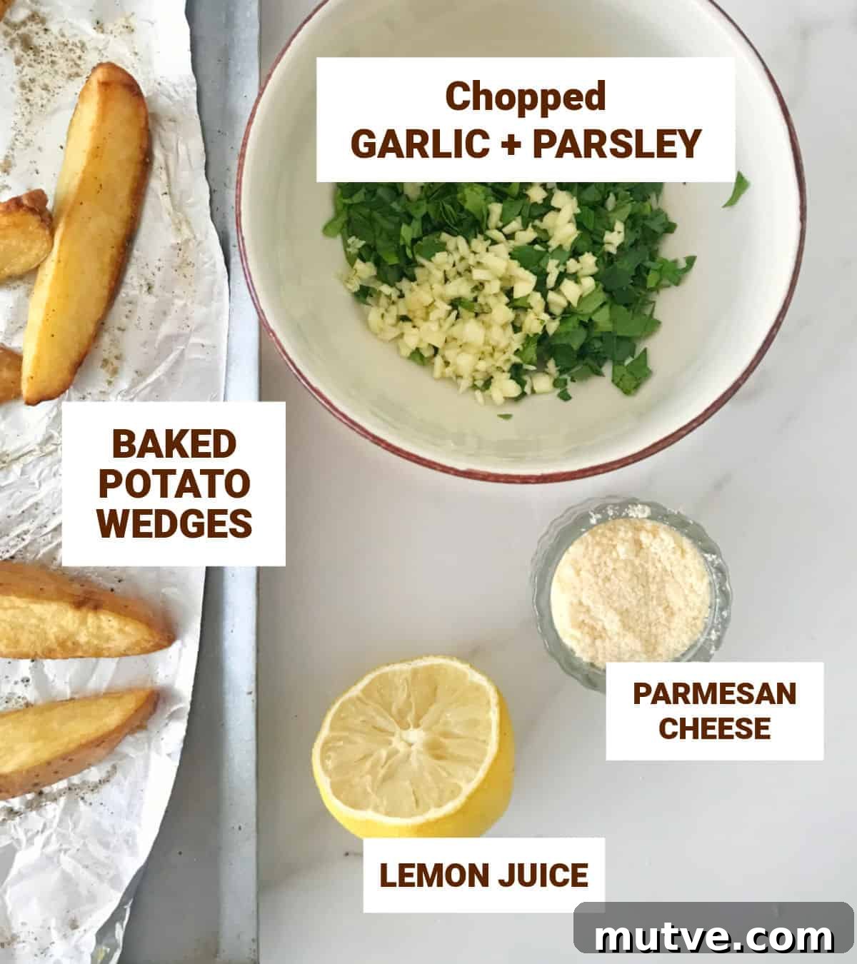 Chopped garlic and parsley, parmesan in bowls, half a lemon, potato wedges, white surface.