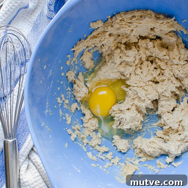 creaming egg and sugar with egg
