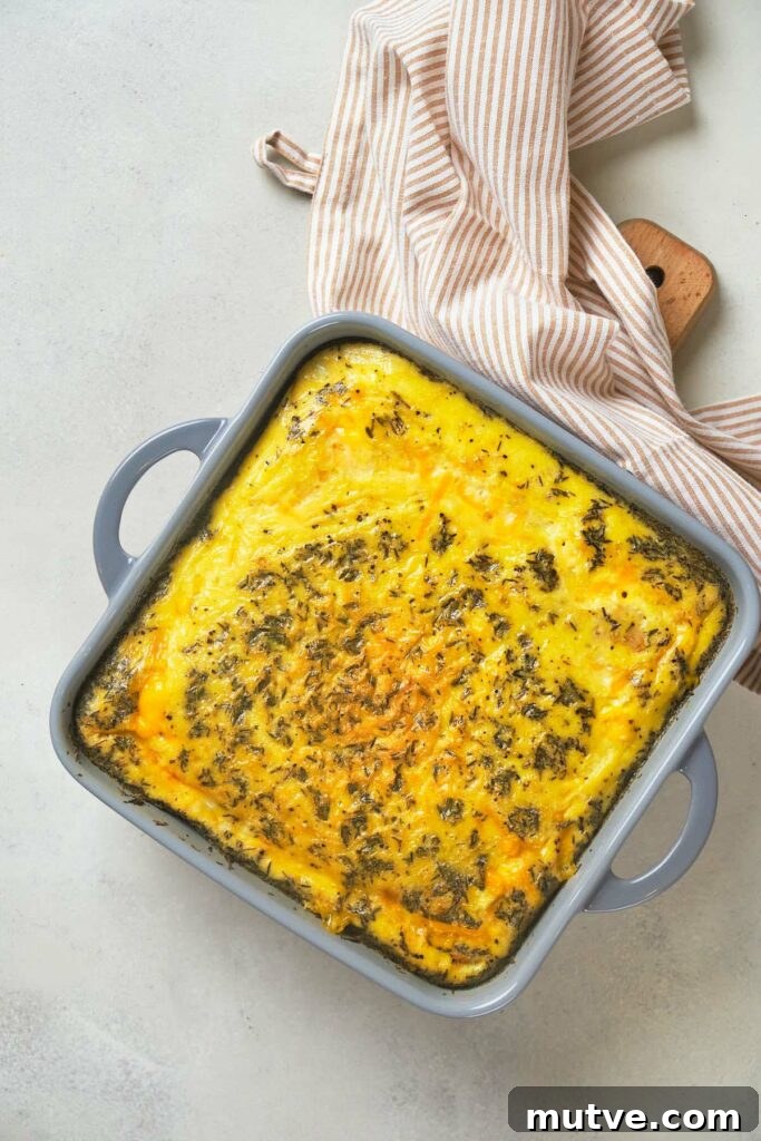 Square baking dish containing breakfast casserole.