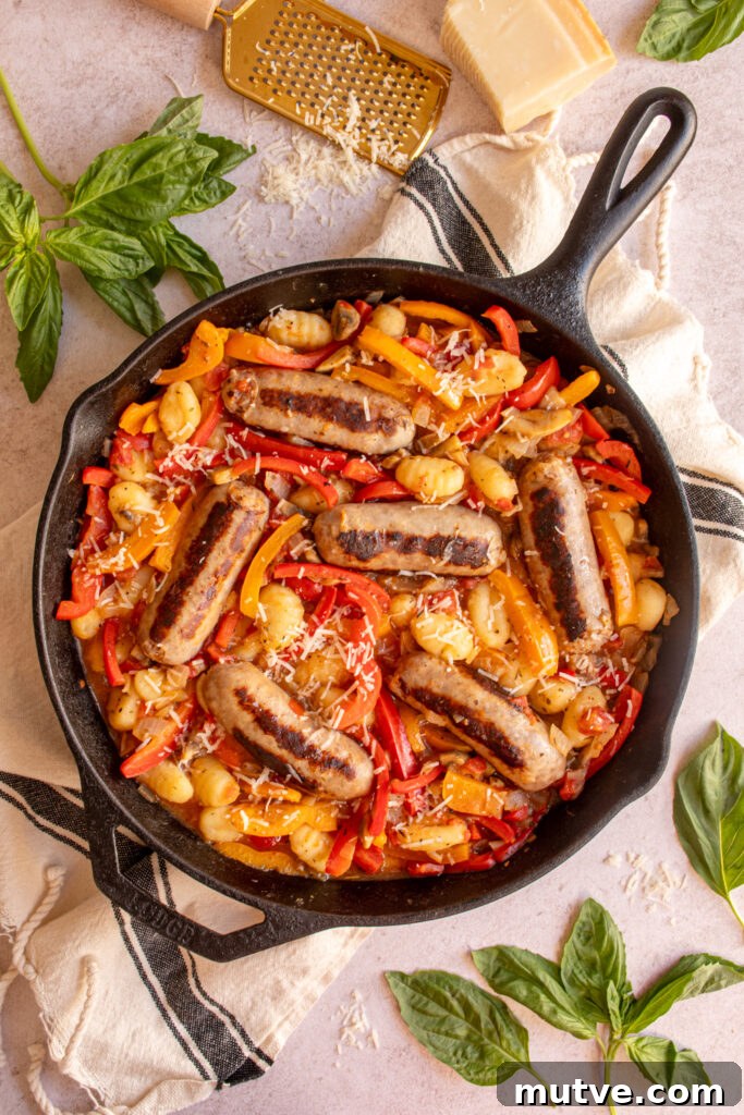 Skillet Gnocchi with Italian Sausage and Peppers 9 Overhead view of a large skillet with bell peppers, sausage, and gnocchi.