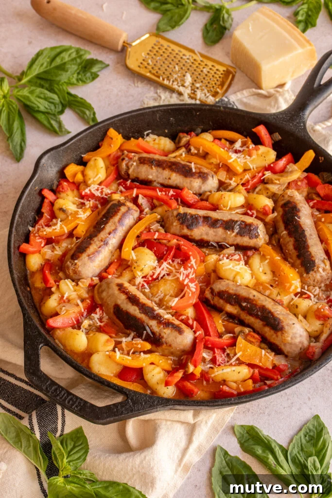 Skillet Gnocchi with Italian Sausage and Peppers 10 A cast iron skillet filled with colorful peppers, gnocchi, and sausages.