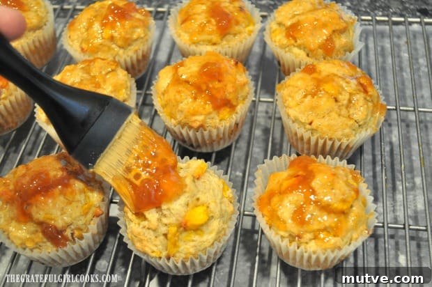Peach Jam Muffins -The Grateful Girl Cooks! Peach jam is brushed on top of each muffin with a pastry brush.