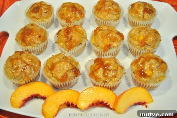 Peach Jam Muffins -The Grateful Girl Cooks! One dozen peach jam muffins on white serving tray, ready to eat!
