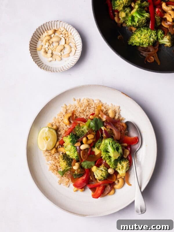 Crispy Air Fryer Broccoli in 10 Minutes 9 Broccoli Stir Fry served on a plate with brown rice.