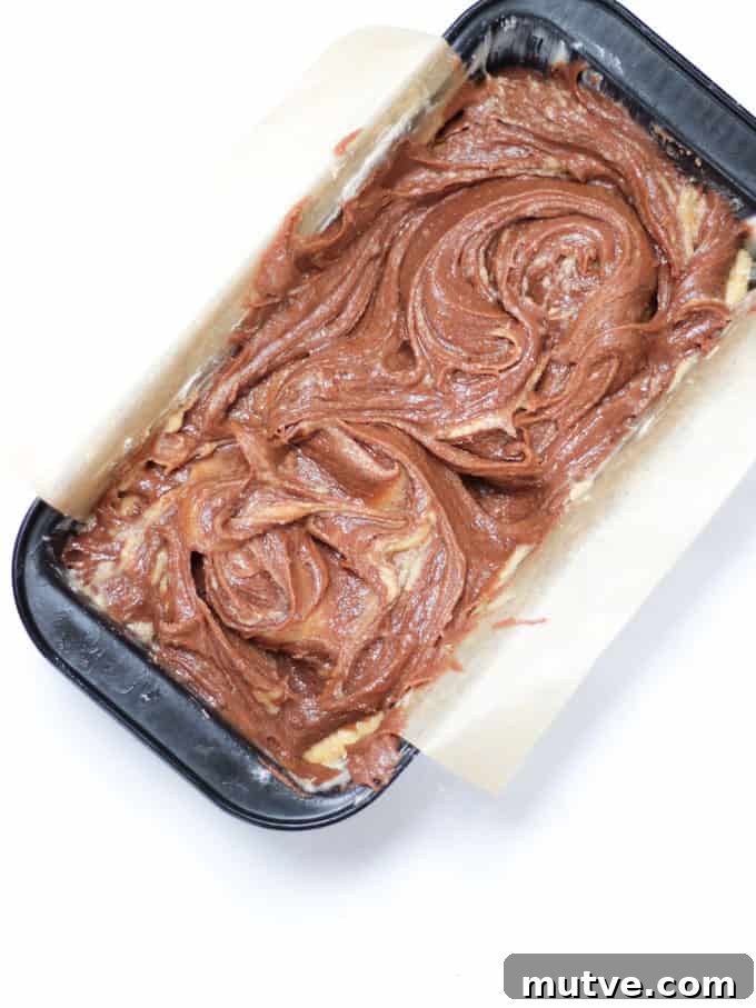 Quick Nutella Cake Recipe: Moist Chocolate Hazelnut Cake 5 Raw Nutella Cake batter in a loaf tin.