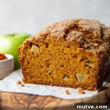 Cinnamon-Spiced Pumpkin Apple Bread 11 loaf of pumpkin apple bread topped with cinnamon streusel.