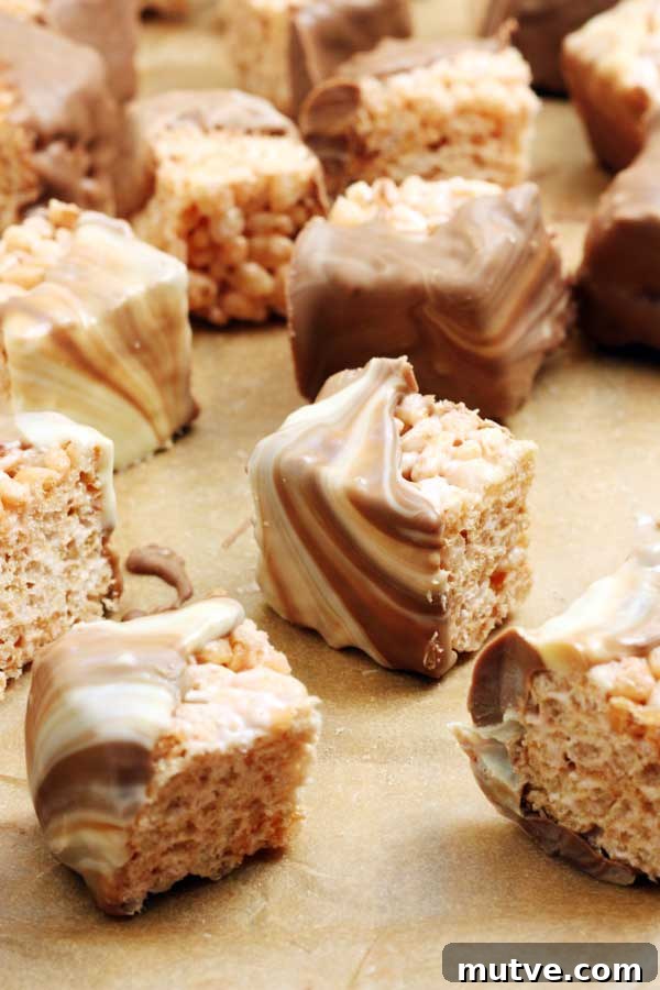 5 Last-Minute Chocolate Gift Ideas for Chocolate Lovers 6 Closeup of marshmallow crispy squares on brown baking paper.