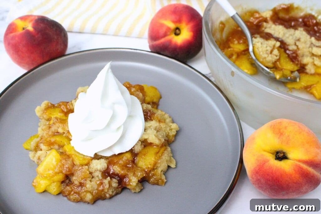Quick Microwave Peach Crumble Recipe 9 microwave peach crumble topped with whipped cream next to the larger crumble baking dish