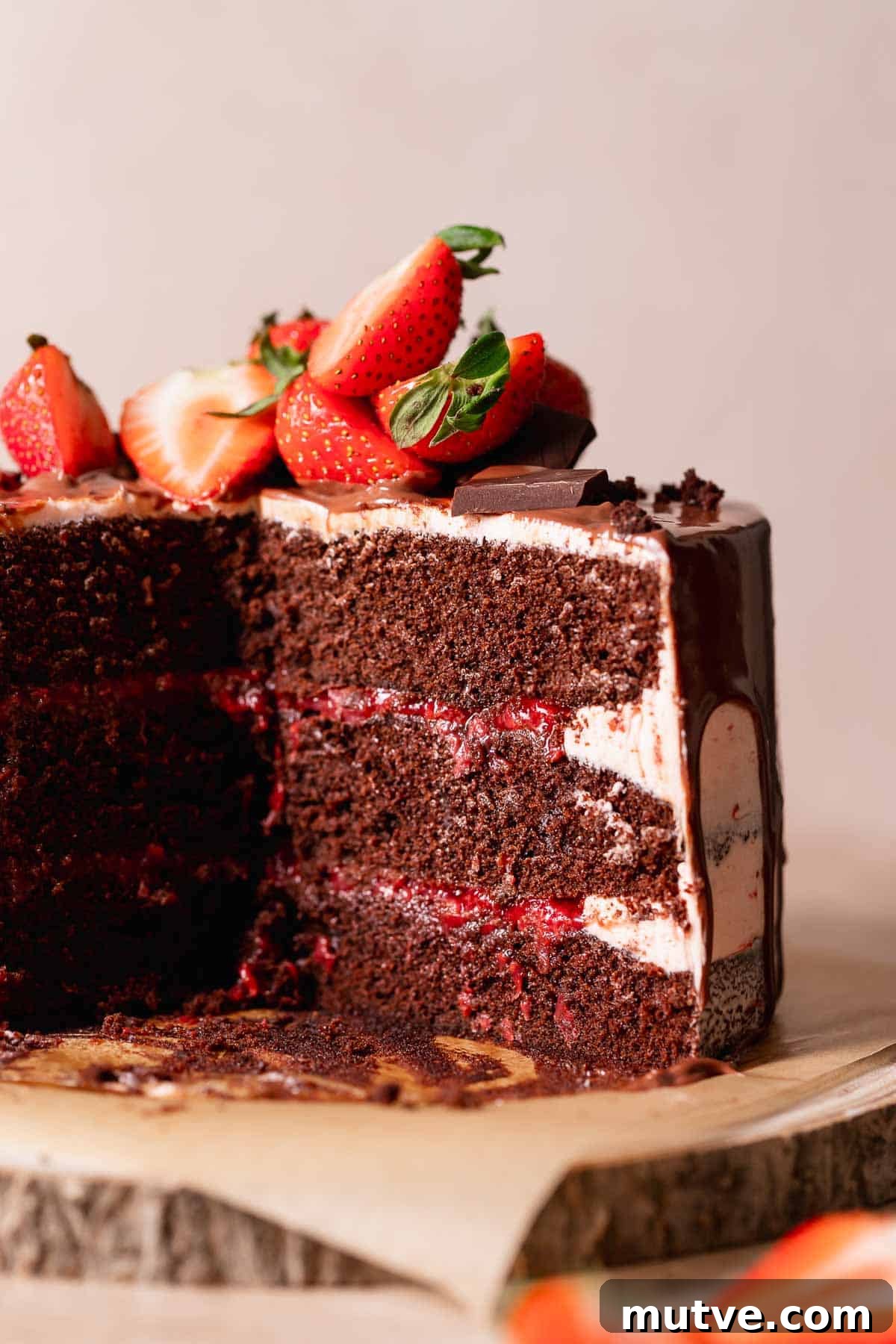 Chocolate Strawberry Layer Cake Recipe 2 Chocolate cake with strawberry filling cut in half to show the layers.