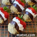 s'mores dipped strawberries on a wire rack and sheet pan