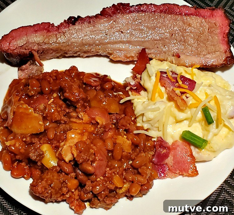Smoked Loaded Baked Beans Recipe in a Cast Iron Dutch Oven 6 Smoked Baked Beans Served With Loaded Potatoes And Brisket